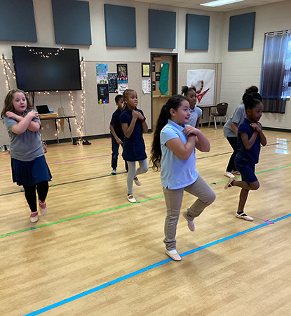 Young dancers standing in a line